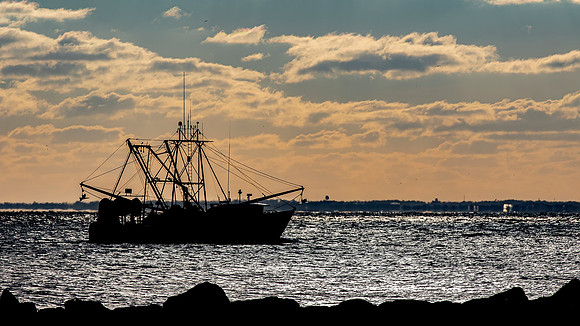Poquoson- Ocean Trawler under Golden Skies Image by Glenn Woodell